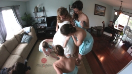 girls helping aley with her dress